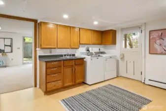 Sizeable laundry room sits next to the family room.
