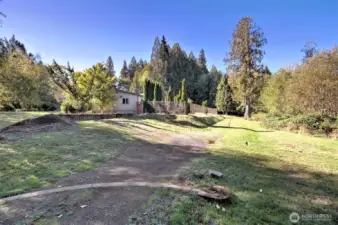 View from the gate as you enter the property. Notice the paved "arch" on the bottom that the gate wheel drives over...