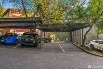 Covered and deeded parking just outside your front pathway that leads you to your home. PLUS guest parking.