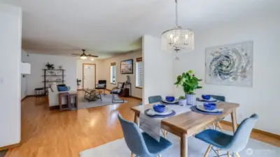 This dining room, conveniently located by the back door to the backyard, offers easy access to the open kitchen and seamless flow into the living room, making it perfect for entertaining