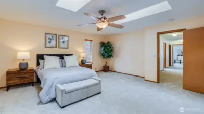 The primary bedroom provides an expansive layout, offering plenty of room for relaxation and personalization