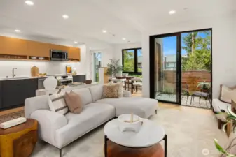 The great room is designed to seamlessly blend with the outdoors and kitchen, creating a harmonious flow that's perfect for both indoor and outdoor entertaining.