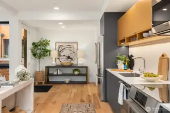 The home is thoughtfully designed to seamlessly blend an inviting, open-concept living area with a gourmet kitchen and flexible spaces, creating a versatile environment for everyday living and entertaining.