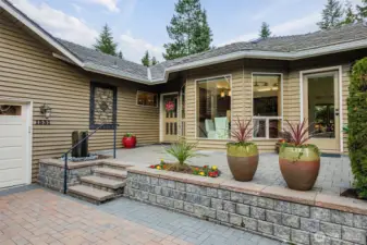 Inviting custom paver patio and driveway.