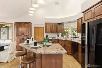 Dine-in kitchen with both island seating and a breakfast nook.