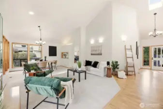 Open concept formal living room, dining room, second gas fireplace. There's an abundance of light and soaring ceilings.