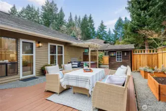 Backyard complete with a deck, a covered area with hot tub, gardening shed and raised flower beds. Sprinkler system and drip lines are in place for ease in watering.