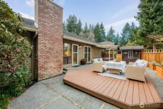 Backyard complete with a deck, a covered area with hot tub, gardening shed and raised flower beds. Sprinkler system and drip lines are in place for ease in watering.