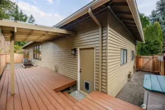 Off the garage is a covered deck area and gas hookup for a BBQ.