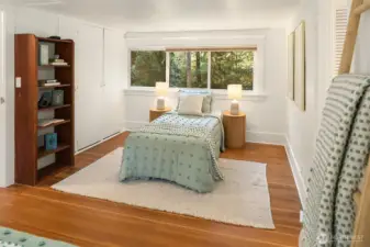 Right side of the large upstairs bedroom with views of the parklike property