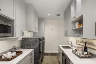 An extensive remodel converted this laundry in to a multifunctional space including a fabulous butler's pantry.