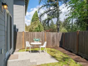 Fully fenced yard with patio
