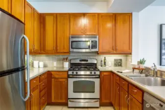 Kitchen featuring solid wood cabinets and stainless steel appliances