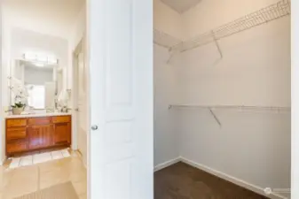 Large walk-in closet and stackable washer and dryer are located in the bathroom