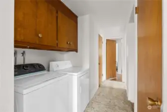 Laundry area in hallway, washer dryer included.