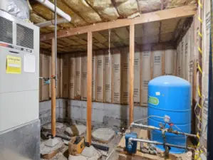 Furnace & additional well pressure tank in the homes basement