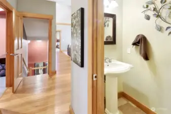 In this hallway, a powder room serves the main floor.