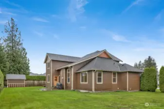 Back of the home...note the mature Emerald Green arbor vitae offering privacy in the back yard.