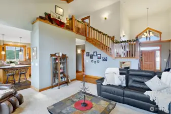 The open staircase makes a statement & assures connection to the upper level.