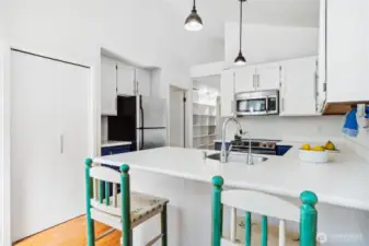 The pantry is to the left and very large.