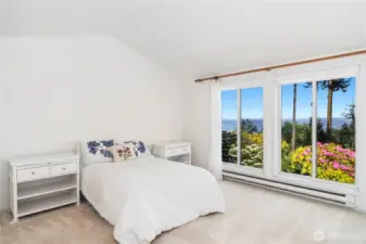 The Primary bedroom has room for a King Size bed. The shades on the windows are very nice as they afford privacy and allow light. An expensive upgrade.