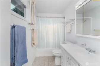 Full bath serving both bedrooms.