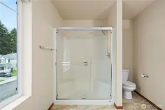 Walking-in shower in the primary bathroom