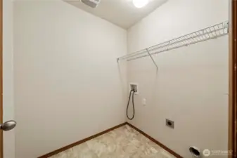 Spacious utility room conveniently located on the upper level with all bedrooms.