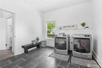 There is a very spacious laundry room with new washer and dryer.