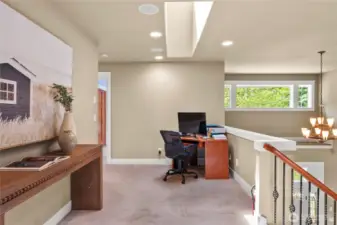 Designed with space for another desk at the top of stairs.