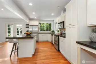 Large kitchen with spacious island.  All appliances stay with home.  French doors go out to backyard