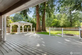 To the immediate left is a stainless steel sink and counter installed to aid in those outdoor entertaining times