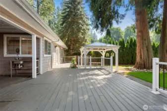 This deck runs the full length of the house.  The gazebo gives you a nice touch for those dinner parties.