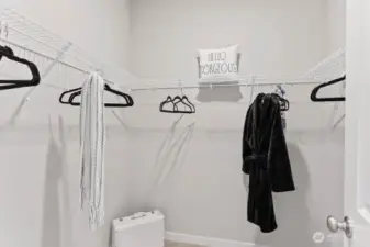 Two walk in closets in the primary bedroom. Photo rendering is representational. Actual home is under construction and finishes, elevation, and paint colors may vary. See site agent for details.