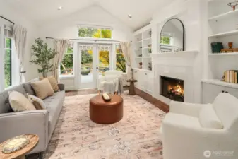 Light, bright den, with vaulted ceilings greets guests, or close the pocket doors for private revelry on a quiet fall day.