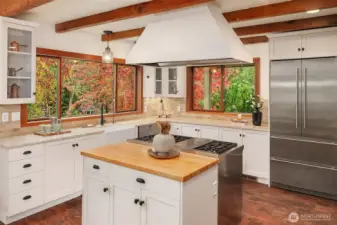 The open concept kitchen boasts high end appliances and smart design. Stay a part of the conversation as friends and family linger in the heart of the home.