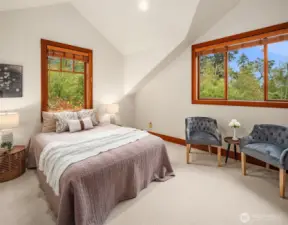Upstairs bedroom 1. These bedrooms are not overlooked: spacious, featuring vaulted ceilings and corner windows.