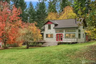Looking south, grand steps ascend to the oversized ironwood deck.