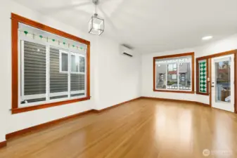 Large windows draw in natural light, enhancing the open and airy feel of the space. Mini-split included.