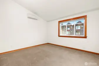 Spacious primary bedroom on the upper floor with mini-split.