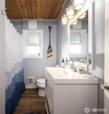 Updated bath with new tub/shower and flooring, plus updated vanity