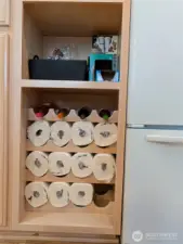 Cabinet with wine rack, now used for paper towel storage