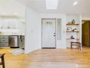 Facing the front door.  The door to the right leads to one of the bedrooms.
