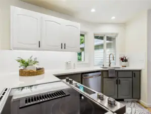 New Stove: 2025, Refrigerator: 2020, Quartz countertop: 2020 new lighting.  There is a heater near the floor below the sink to warm your feetsies while at the sink! Undercounter lighting.