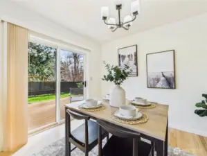 Sliders lead out to the deck and fully fenced yard.