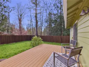 New completely fenced back yard. Trex Deck.