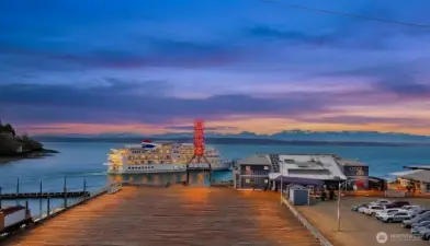 A large passenger ferry heads out to sea.