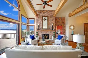 Notice how the deck out the french doors really extends the living space? There is alot of romance about this home and setting. Great designer touches and color pallete all through the home.