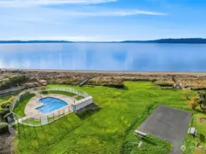 Private pool, pet friendly grounds, & sports court all facing Puget Sound