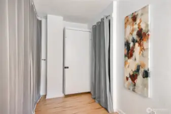 There are 2 Murphy Beds located in the condo. This is the single bed. Curtain can be drawn for privacy.